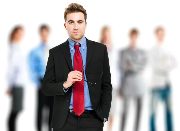 Portrait of a smiling businessman in front of his team — Stock Photo, Image