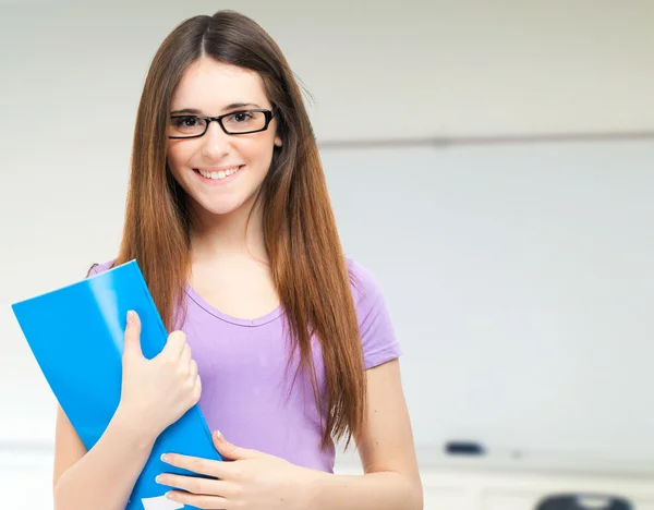 Portrait of a young cute student in her classroom — Stock Photo, Image