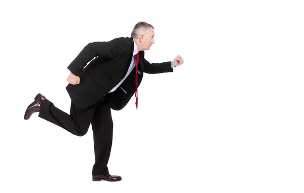 Mature businessman running isolated on white — Stock Photo, Image