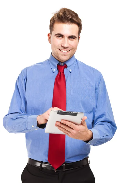 Jonge zakenman met zijn tablet pc Rechtenvrije Stockafbeeldingen