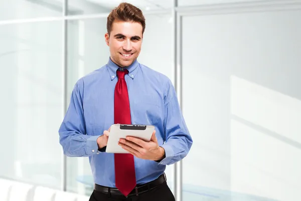 Business man using his tablet Royalty Free Stock Images