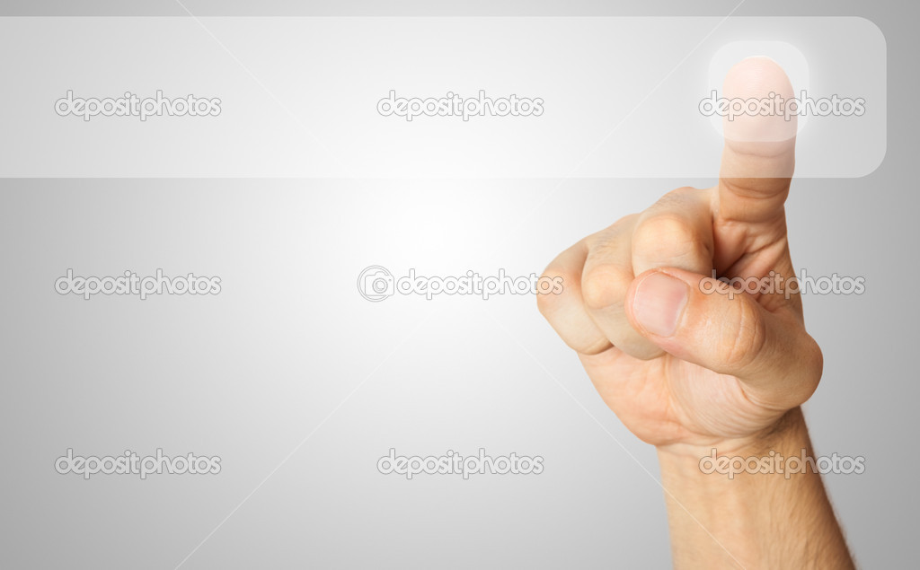 Finger pressing a button
