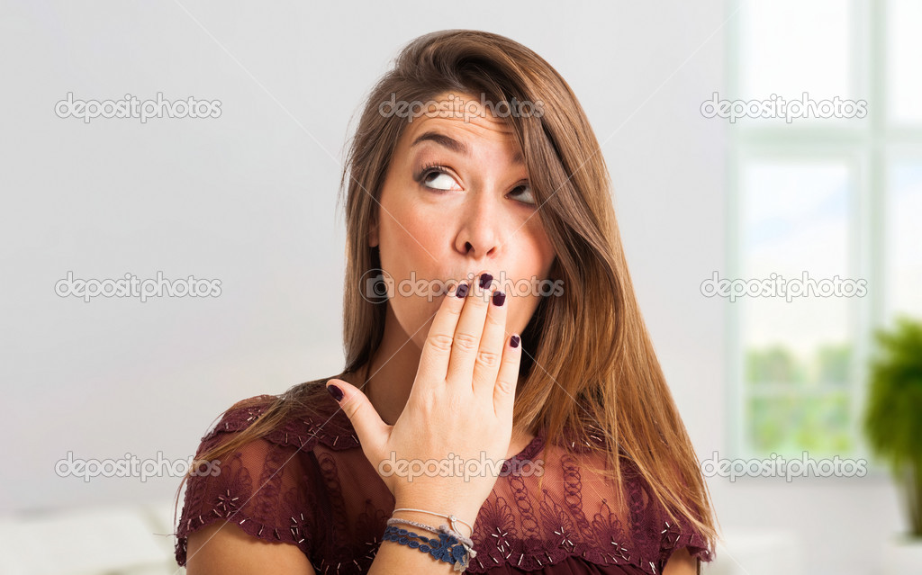 Woman shutting her mouth