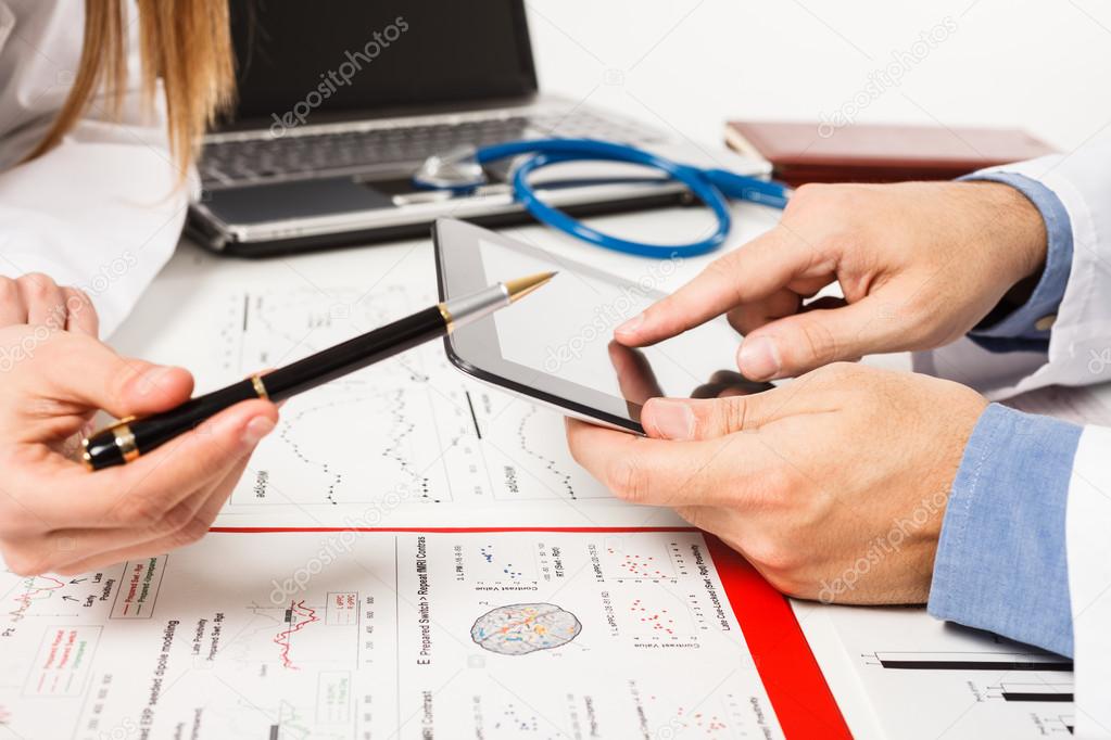 Doctors examining tests