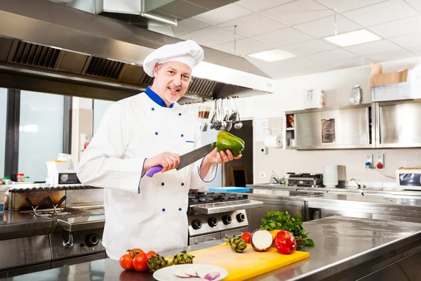 Chef cooking in his kitchen — Stock Photo, Image