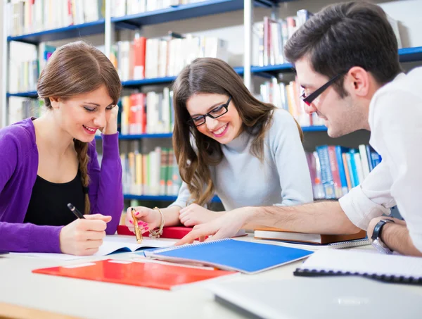 Students in a library — Stock Photo, Image