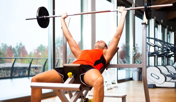 Man lifting a yoke — Stock Photo, Image