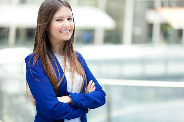 Beautiful young female executive in an urban setting — Stock Photo, Image