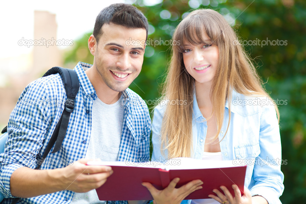 Two students studying in a park
