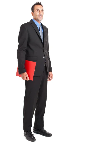 Hombre de negocios guapo sosteniendo un portapapeles — Foto de Stock