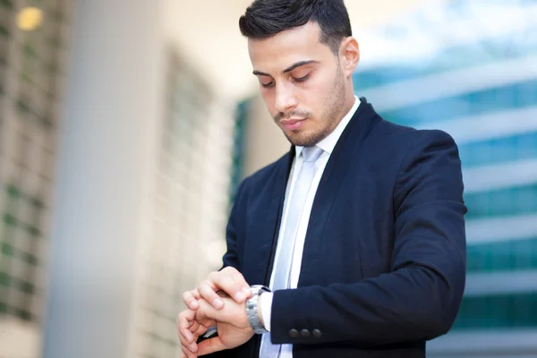 Business man looking at his watch — Stock Photo, Image