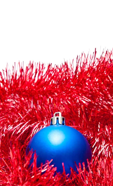 Blue Christmas ball on a red decoration — Stock Photo, Image