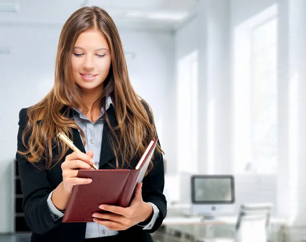 Business woman with agenda — Stock Photo, Image