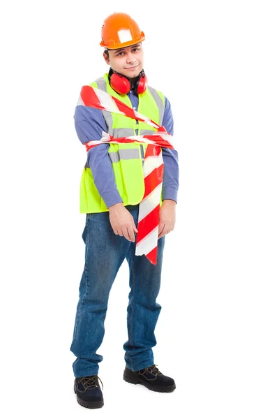 Trabalhador desajeitado amarrado com uma fita — Fotografia de Stock
