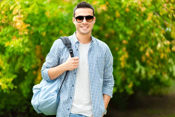 Smiling student in sunglasses — Stock Photo, Image