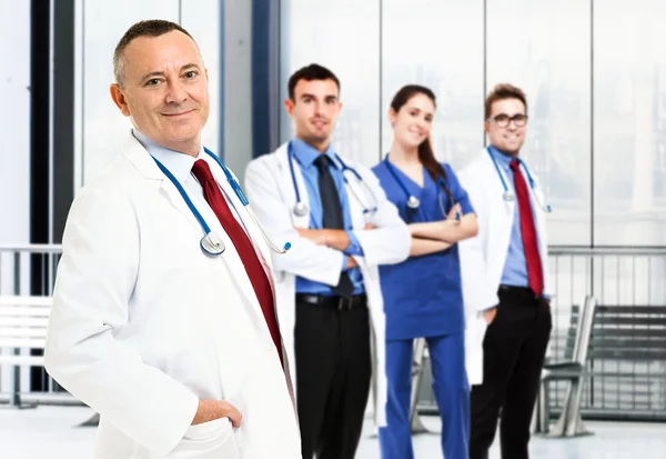 Doctor in front of his team — Stock Photo, Image