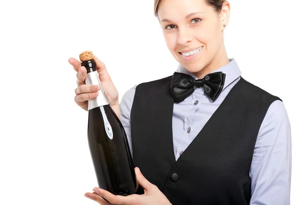 Servitrisen håller en flaska champagne — Stockfoto