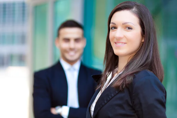 Two business people smiling — Stock Photo, Image