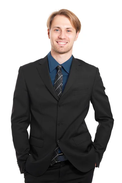 Smiling businessman with hands in pockets — Stock Photo, Image