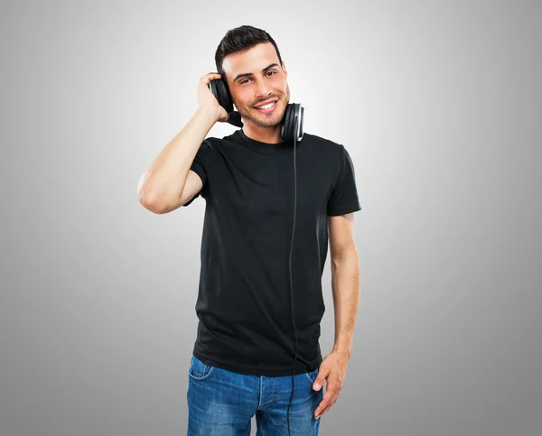 Casual man listening to music — Stock Photo, Image