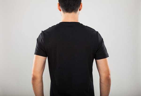 Back of man wearing a black t-shirt