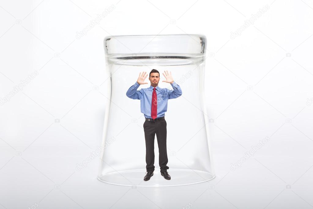 Businessman under a glass