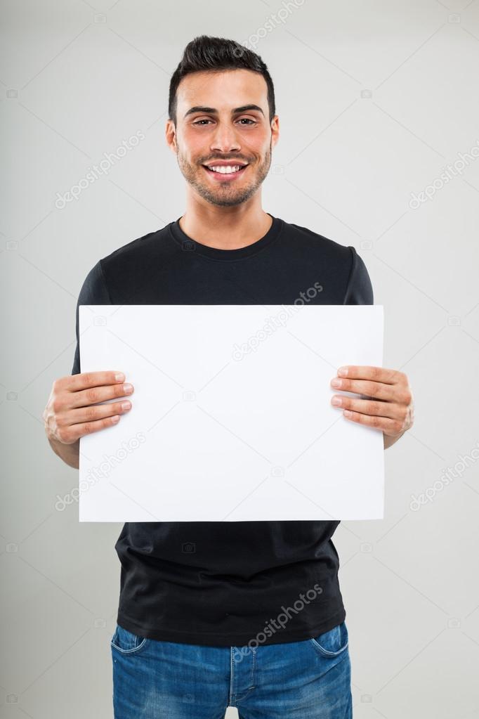 Man holding a white board