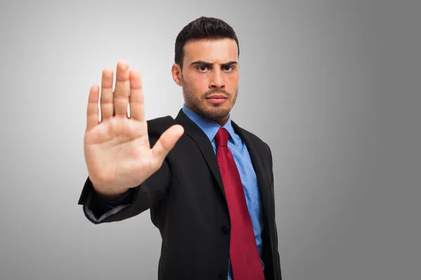 Empresario haciendo una señal de stop — Foto de Stock