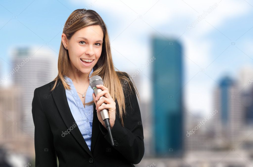 Female reporter with microphone