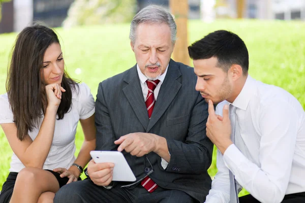 Business people looking at tablet — Stock Photo, Image