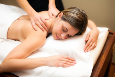 Woman having a massage clipart