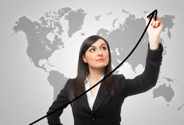 Businesswoman drawing a rising arrow — Stock Photo, Image