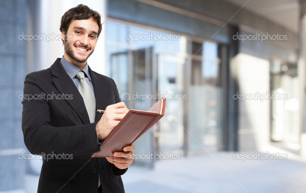 Businessman writing notes