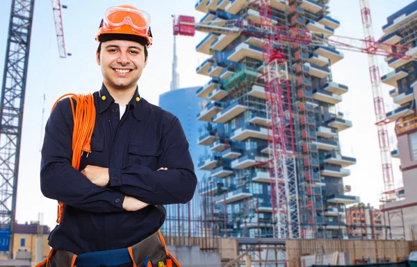 Worker in front of a construction site — Stock Photo, Image