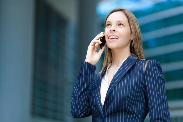 Young businesswoman at phone — Stock Photo, Image