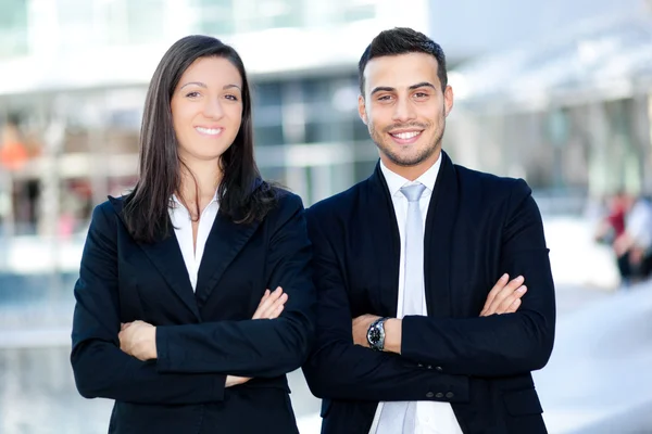 Two business people smiling outdoor — Stock Photo, Image