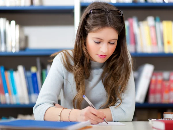 Girl in a library Stock Photo