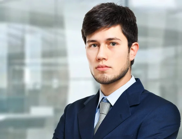 Handsome businessman in an urban setting — Stock Photo, Image