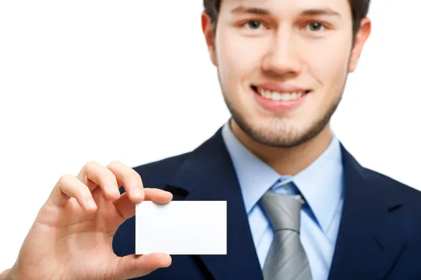 Hombre de negocios sosteniendo una tarjeta de visita en blanco —  Fotos de Stock