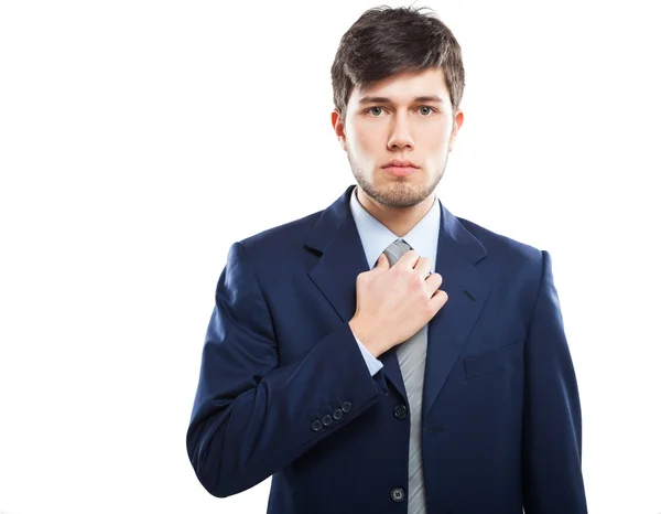 Businessman adjusting his necktie — Stock Photo, Image