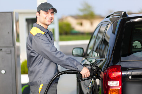Gas station attendant at work