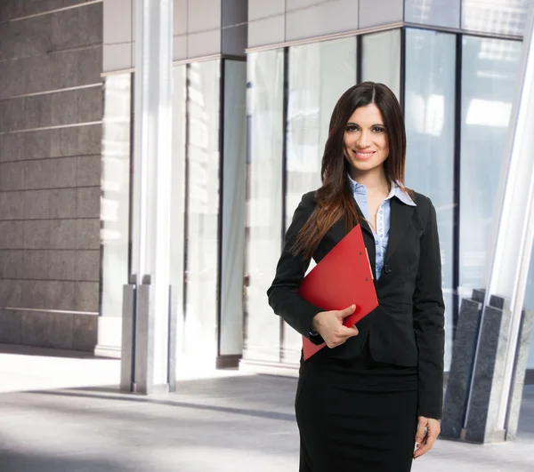 Business woman holding folder — Stock Photo, Image