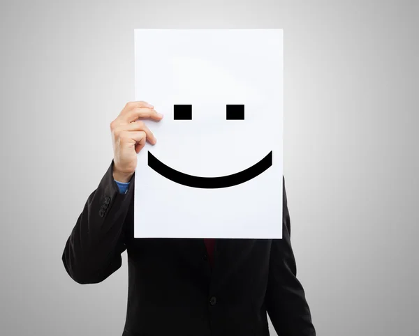 Mann mit einem glücklichen Emoticon — Stockfoto