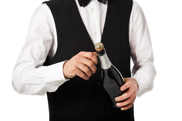 Waiter holding a champagne bottle — Stock Photo, Image