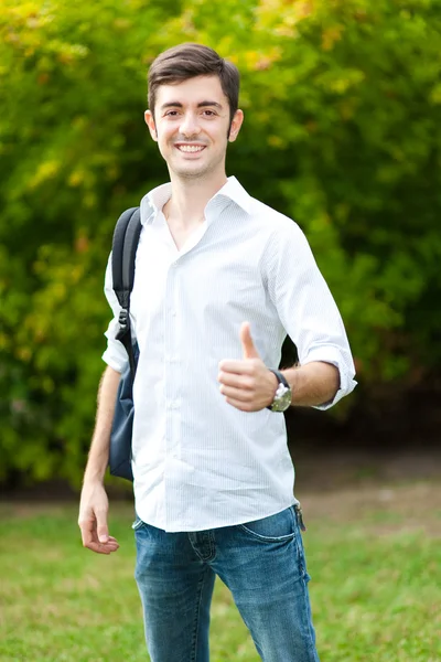 Estudiante sosteniendo pulgares hacia arriba —  Fotos de Stock