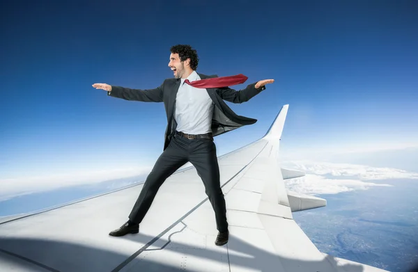 Empresario montando un avión —  Fotos de Stock