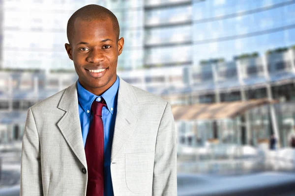 Businessman in a city landscape — Stock Photo, Image