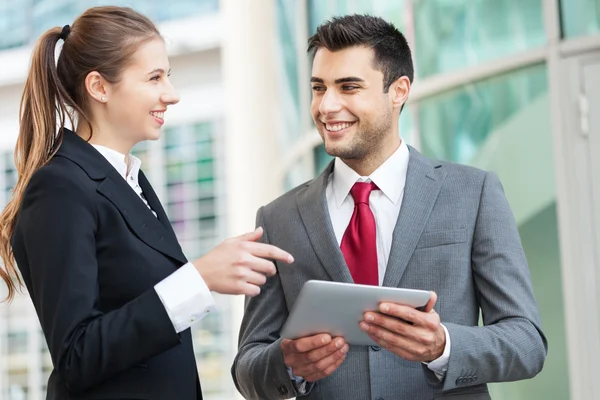 Business people using a digital tablet — Stock Photo, Image