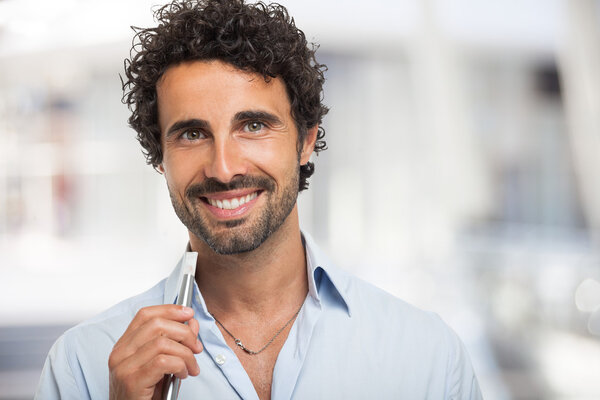 Man holding an electronic cigarette