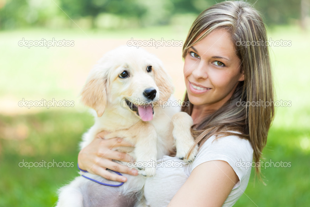 Girl holding her dog